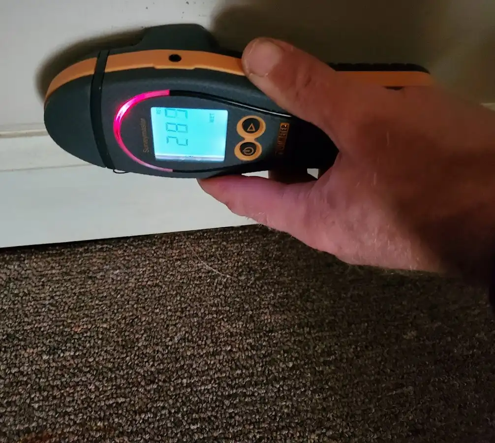 Moisture detection at baseboard during Storm Damage Restoration in Concord